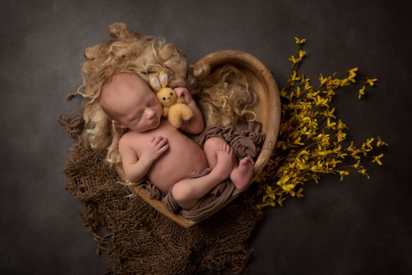 newborn and family photographer ipswich tiny baby with yellow flowers