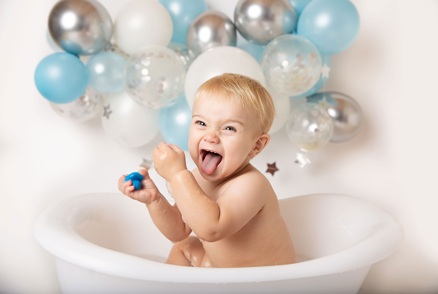 newborn and family photographer ipswich cake smash boy laughing blue silver white newborn and family photographer ipswich cake smash boy laughing blue silver white