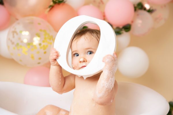 newborn and family photographer ipswich cake smash peekaboo