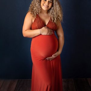expectant mama in copper orange dress